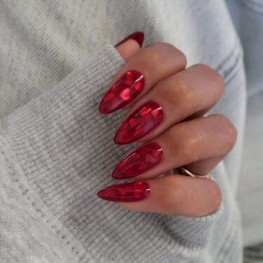 Long nails with jelly polish and heart-shaped glitter